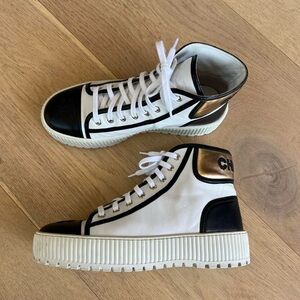 CHANEL White and Black Sneakers with Gold Accents